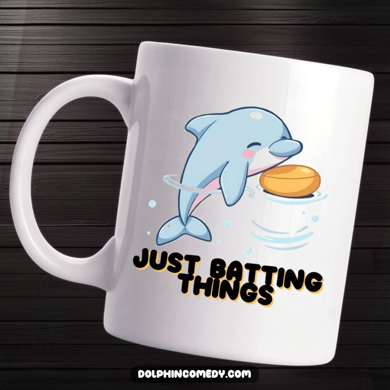 Funny dolphin mug depicting a playful dolphin gently nudging a colorful floating object with its snout, mid-ocean.