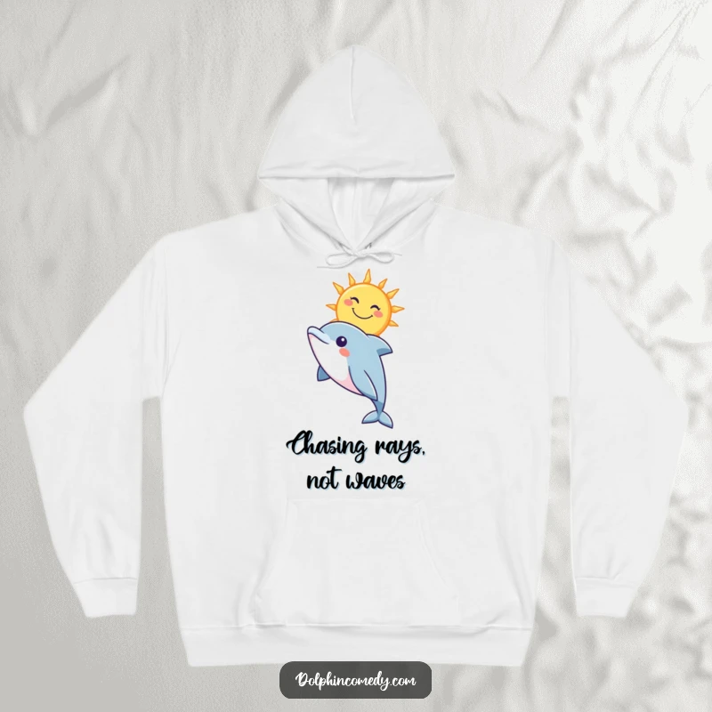 Funny hoodie depicting a curious dolphin looking up at a smiling sun, offering warmth and seaside cheer.