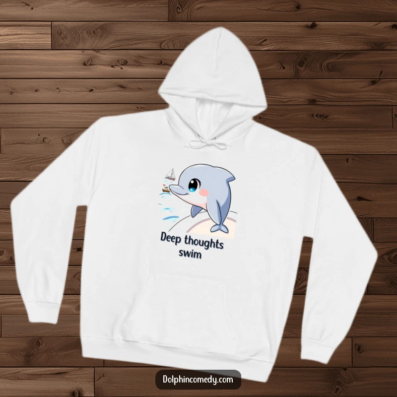 Funny hoodie showcasing a dolphin with large, intelligent eyes observing a passing boat, ideal for cozy contemplation.