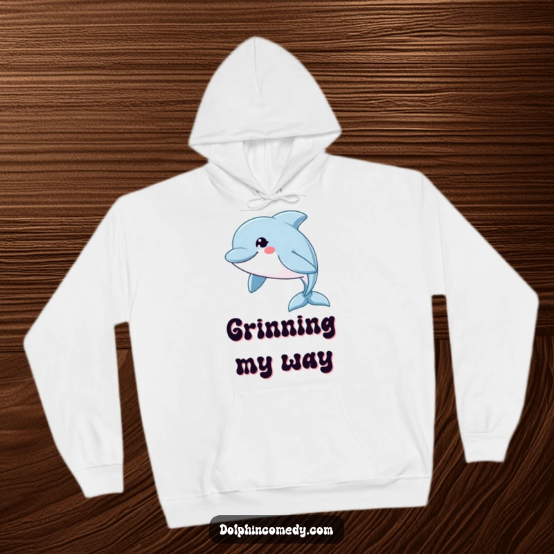 Funny Hoodie: A dolphin with a wide, friendly grin swims swiftly, designed for cozy and humorous wear.