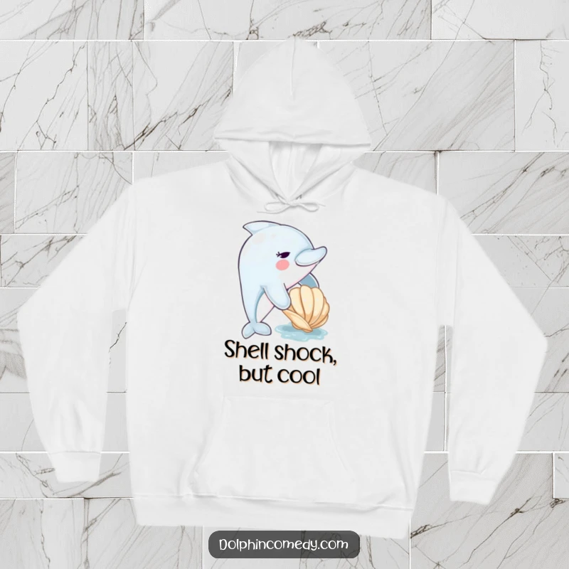 Funny dolphin hoodie showing a cute dolphin nudging a seashell, conveying a sense of gentle playfulness and ocean wonder.