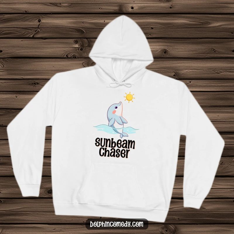 Funny dolphin hoodie showing a curious dolphin looking up at a sunbeam, offering warmth and a touch of oceanic curiosity.
