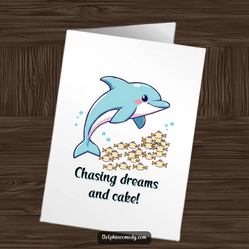 Free Printable Birthday Card: Dolphin playfully chases a school of tiny fish, full of energy.
