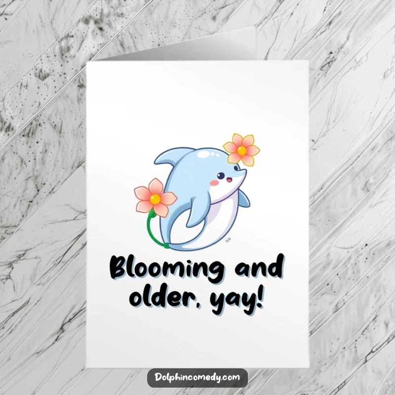 Funny Free Printable Birthday Card: A dolphin gracefully swims with a flower, conveying peaceful birthday wishes, downloadable.