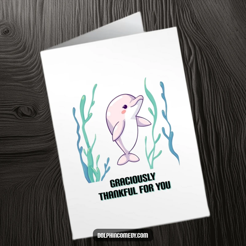 Funny Free Printable Thank You Card with a dolphin gracefully dancing with outstretched fins through an underwater kelp forest.