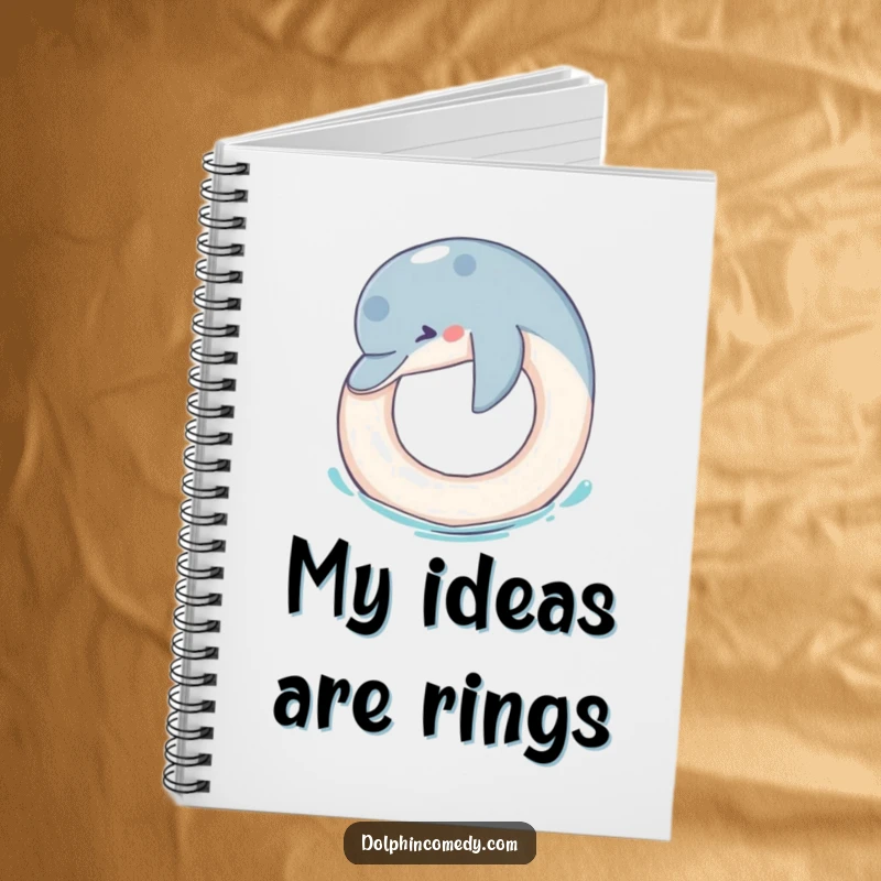 Funny Notebook: A dolphin playfully nudges a floating ring, offering a humorous and inspiring cover for your notes.