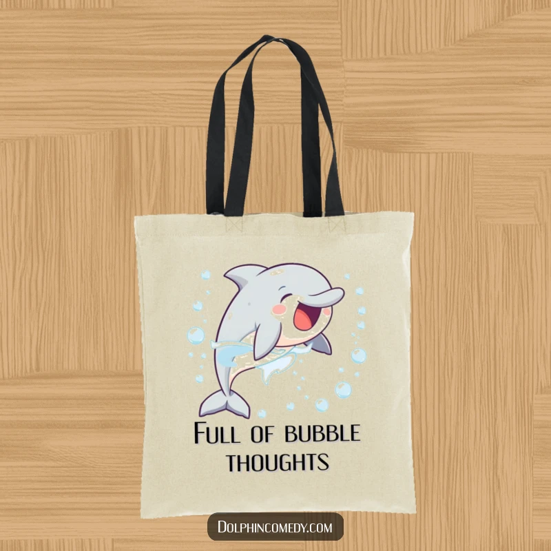 Funny tote bag illustrated with a delighted dolphin chasing a stream of bubbles, perfect for carrying essentials with cheerful energy.