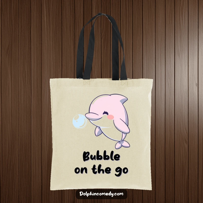 Funny reusable tote bag showcasing a happy dolphin blowing a shimmering water bubble, great for shopping.